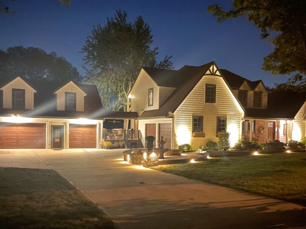 A suburban house lit up at night.
